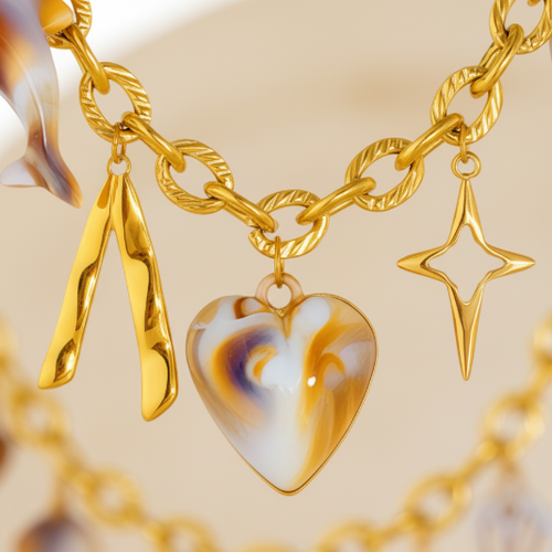 Gold charm necklace close-up detail