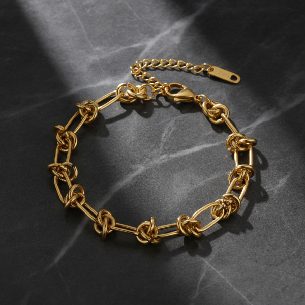 Gold knot bracelet on marble